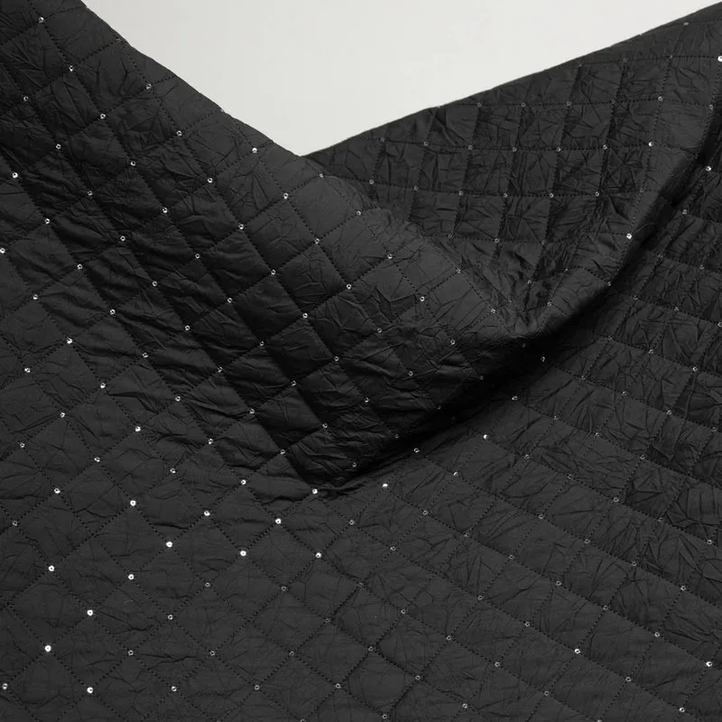 Tissu matelassé en polyester avec paillettes | Noir | Deadstock de designer