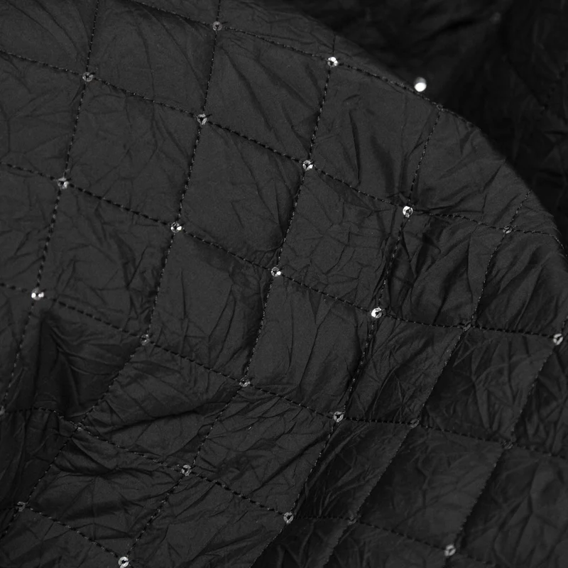Tissu matelassé en polyester avec paillettes | Noir | Deadstock de designer